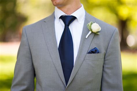 navy suit grey tie